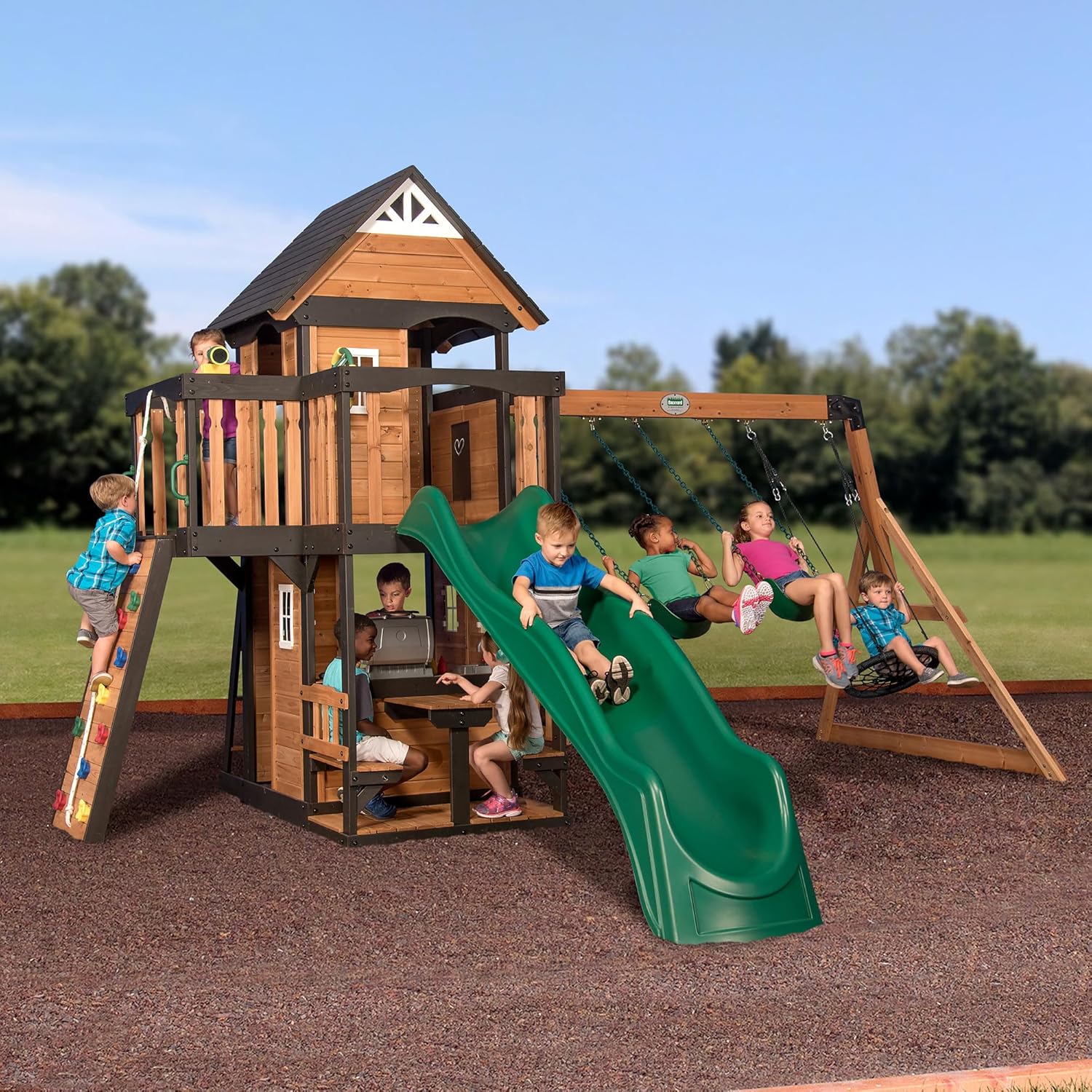 443aab2c4e206a6b04c546abeed43cd594b44943ff00576af8f12d5b643b7d4e Backyard Discovery Canyon Creek Cedar Wood Swing Set with Wave Slide, Clubhouse, Play Kitchen, Picnic Area, Belt Swings, Web Swing, Rock Wall,...