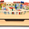 The dual-function wooden children's activity table with storage function, featuring 100 colorful components, tracks, trains, and cars, is a...