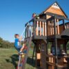 Backyard Discovery Canyon Creek Cedar Wood Swing Set with Wave Slide, Clubhouse, Play Kitchen, Picnic Area, Belt Swings, Web Swing, Rock Wall,...